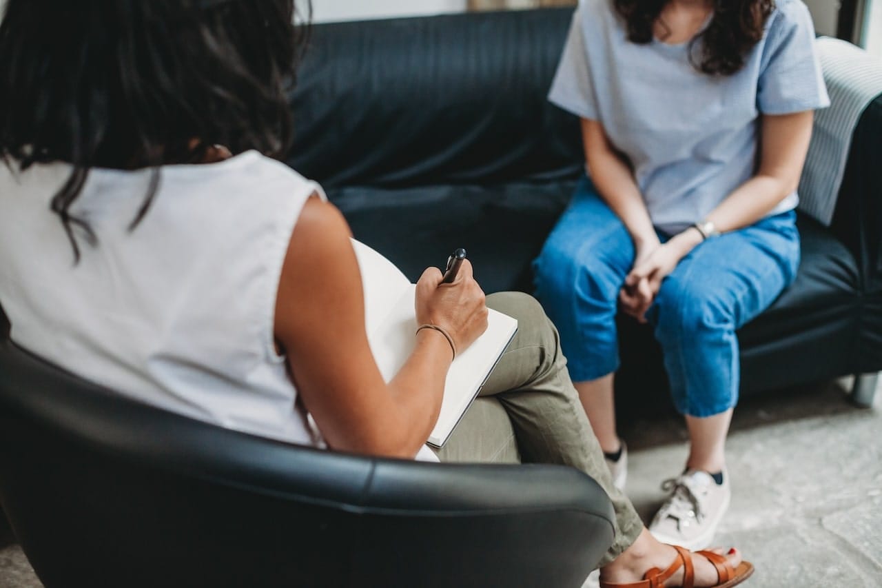 therapist having a session with a patient in a sound treated room