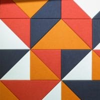 decorative, yet functional acoustic panels, with red, orange, white and black panels