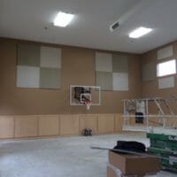 Helping turn a gym into a classroom with Acoustical Surfaces.